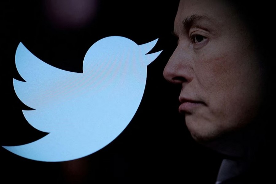 Twitter logo and a photo of Elon Musk are displayed through magnifier in this illustration taken October 27, 2022. REUTERS/Dado Ruvic/Illustration