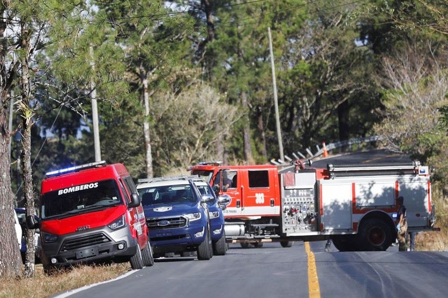 Rescue teams work at the site of the accident of a bus, which was carrying migrants who had traveled through the Darien gap, in Los Planes de Gualaca, Panama on February 15, 2023 — Reuters photo