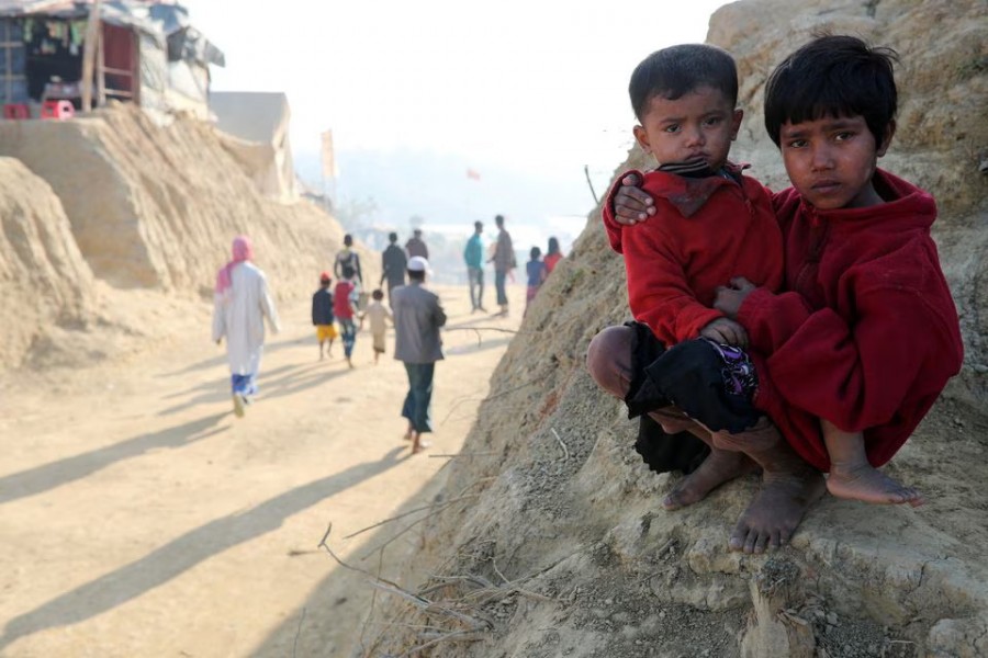 Rohingya refugee children look on at the Jamtoli camp in the morning in Cox's Bazar, Bangladesh on January 22, 2018 — Reuters/Files