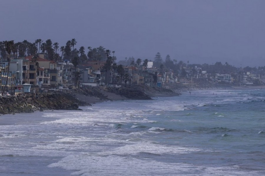 Waves come to shore along the coastline as a winter storm approaches Oceanside, California, U.S., February 21, 2023. REUTERS/Mike Blake