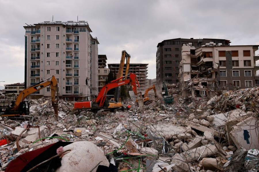 Workers clean the rubble of a collapsed building in the aftermath of a deadly earthquake in Antakya, Hatay province, Turkey on February 21, 2023 — Reuters photo